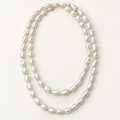 50-inch white baroque pearl necklace styled in two loops