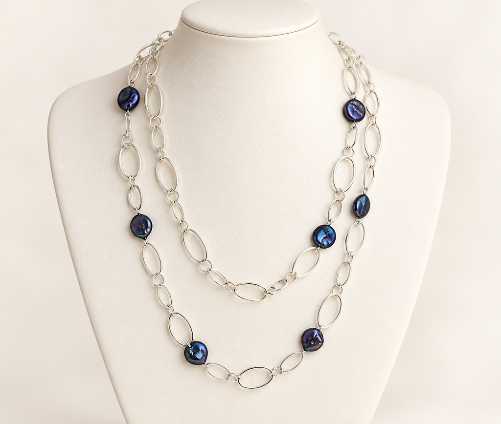 Black coin pearl station necklace with silver-plated chain shown doubled