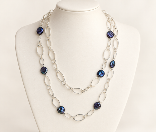 Black coin pearl station necklace with silver-plated chain shown doubled