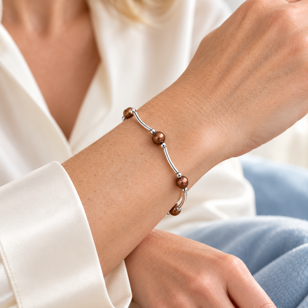 AI styling visualization of a woman wearing brown freshwater pearl and silver-tone bar stretch bracelet