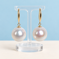AI product visualization of 13–14 mm white cultured pearl drop earrings with 18K yellow gold