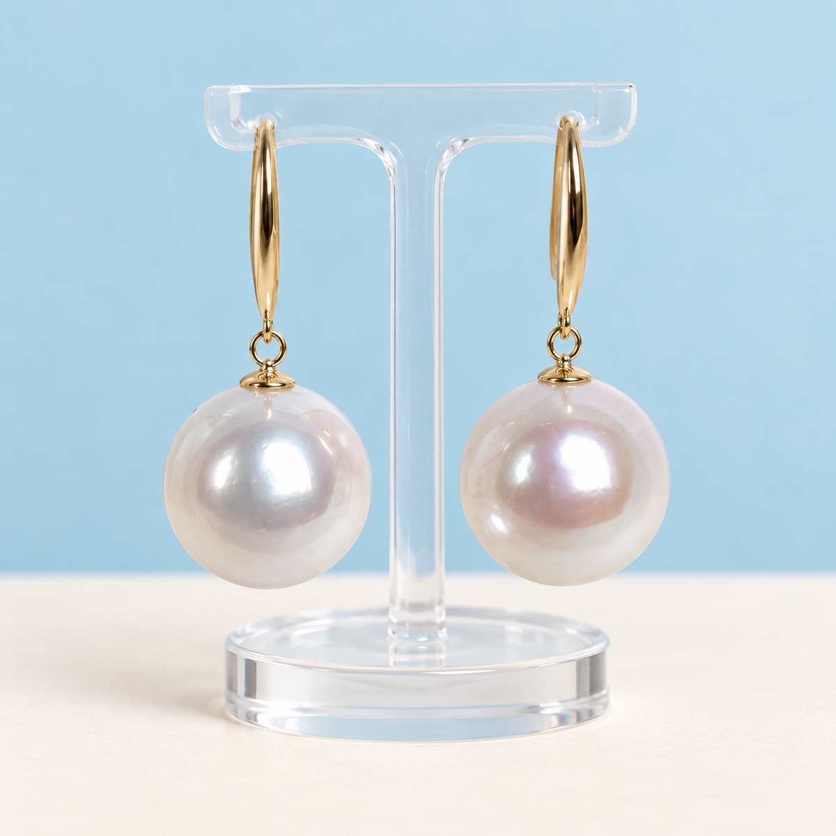 AI product visualization of 13–14 mm white cultured pearl drop earrings with 18K yellow gold