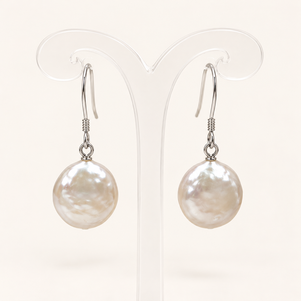 Studio visualization of 12mm white cultured coin pearl drop earrings