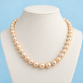 AI product visualization of 9 mm peach pearl necklace