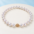 AI product visualization of white cultured pearl necklace with round gold clasp
