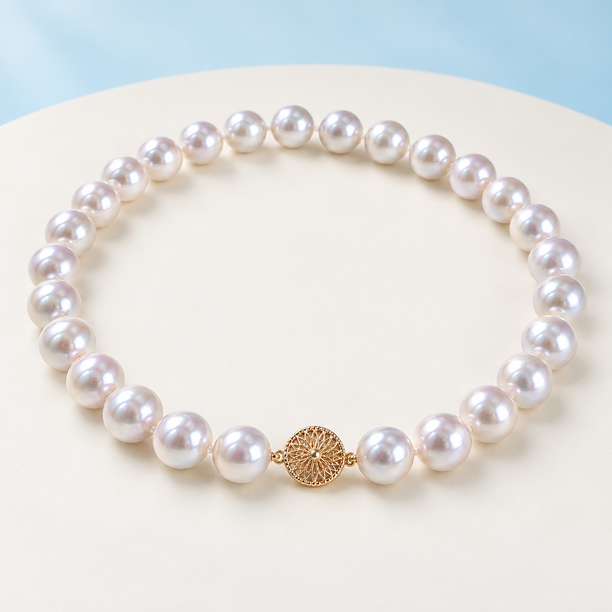 AI product visualization of white cultured pearl necklace with round gold clasp