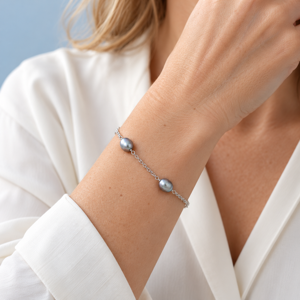 AI styling visualization of a woman wearing silver-grey freshwater pearl station bracelet