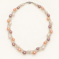 White peach and pink rice pearl twist necklace on ivory background