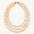 Triple-strand white freshwater pearl necklace with round silver-tone clasp