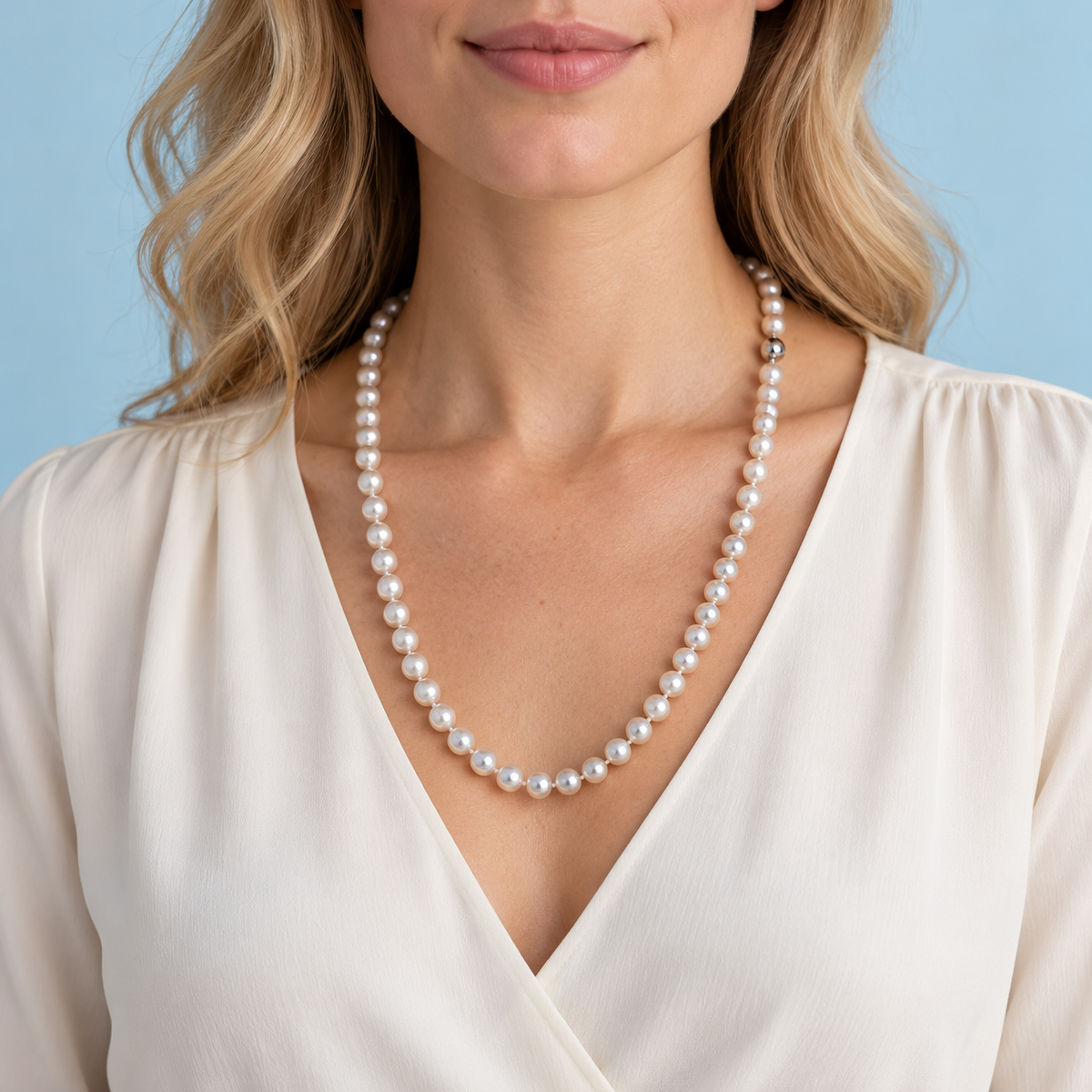 Model wearing 22-inch white freshwater pearl necklace